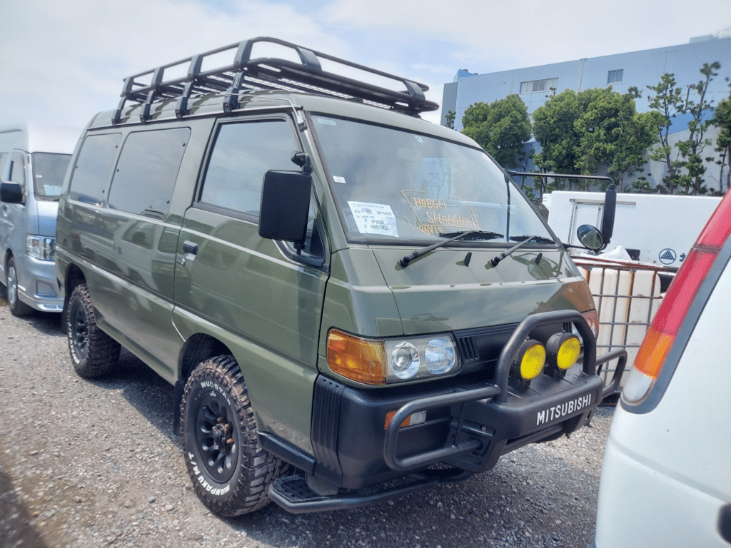 Mitsubishi Delica, JDM minivan, 4WD capability, Spacious interior, Versatile seating, roof rack, Off-road adventurer, bull bar, Reliable performance, Classic MPV, Japan Car Direct