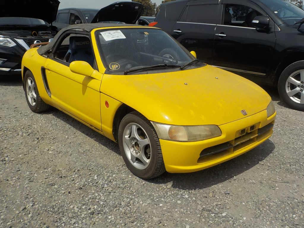 Honda Beat, JDM kei car, Yellow car, Convertible roadster, Micro sports car, Rear-wheel drive, Fun to drive, Zippy performance, Compact size, City cruiser, Japan Car Direct