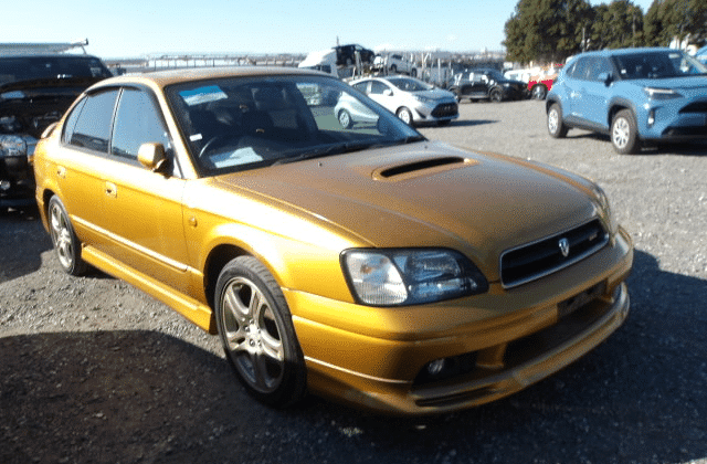 Gold Subaru Legacy, Luxury Sedan, Premium Car, Sleek Design, Reliable Performance, All-Wheel Drive, Export From Japan, Hood Scoop, Eye-Catching Color, Japan Car Direct