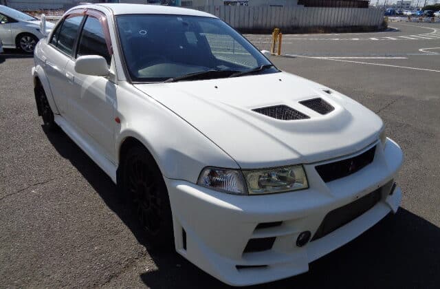 Mitsubishi Lancer Evolution VI, Import Lancer Evo VI, Japanese Car Auctions, White Evo VI, Mitsubishi Evo Performance, Rally-inspired Vehicle, Evo VI Importing, Japan Car Exports, Japan Car Direct, CN9A
