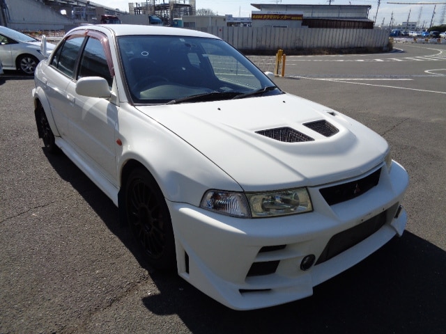 Mitsubishi Lancer Evolution VI, Import Lancer Evo VI, Japanese Car Auctions, White Evo VI, Mitsubishi Evo Performance, Rally-inspired Vehicle, Evo VI Importing, Japan Car Exports, Japan Car Direct, CN9A