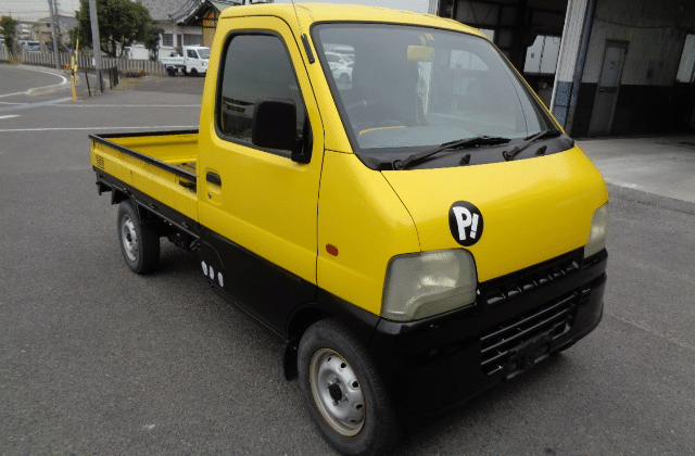 Suzuki Carry, Yellow and Black, Compact Utility Truck, Lightweight Pickup, Cargo Vehicle, Japanese Workhorse, Japan Car Auctions, Small Delivery Truck, Reliable Performance, Japan Car Direct